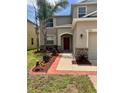 Charming two-story home with manicured lawn, stone accents, and a two car garage at 2332 Dovesong Trace Dr, Ruskin, FL 33570