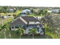 Expansive aerial view of the property showcasing the pool, landscaping, and surrounding neighborhood at 24342 Saragossa Ln, Punta Gorda, FL 33955