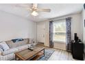Bright living room with sofa, coffee table, and large window at 3718 59Th Ave W # 3718, Bradenton, FL 34210