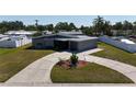 An aerial view of the well-maintained house with a circular driveway at 5727 25Th W St, Bradenton, FL 34207