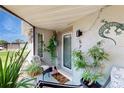 Charming front porch with plants and decorative elements enhancing curb appeal at 5727 25Th W St, Bradenton, FL 34207