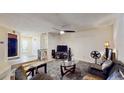 Bright living room with a ceiling fan and comfortable seating arrangement at 5727 25Th W St, Bradenton, FL 34207