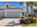Charming single Gathering home with a large two car garage, beautiful landscaping, and striking curb appeal at 6255 Cassia St, Bradenton, FL 34203