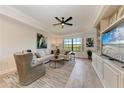 Comfortable living room featuring a neutral color palette, stylish furnishings, and natural light at 7710 Lake Vista Ct # 407, Lakewood Ranch, FL 34202