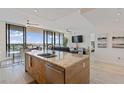 Modern kitchen with stainless steel appliances, granite countertops, and an island at 1155 N Gulfstream Ave # 508, Sarasota, FL 34236
