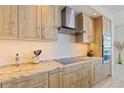 Stylish kitchen with granite counters, stainless appliances, and ample cabinet space at 1155 N Gulfstream Ave # 508, Sarasota, FL 34236
