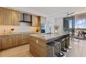 Bright kitchen featuring stainless steel appliances, granite countertops, and a breakfast bar at 1155 N Gulfstream Ave # 508, Sarasota, FL 34236
