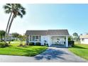 Inviting home with covered parking, enhanced by mature trees and well manicured lawn at 2752 Riverbluff Pl # 66, Sarasota, FL 34231