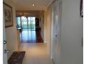 Inviting condo foyer features tile flooring and a view through to the living room with hardwood floors at 3780 Pinebrook Cir # 102, Bradenton, FL 34209