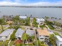 Stunning aerial view of a waterfront property with lush landscaping and neighborhood with water access at 4109 Riverview Blvd, Bradenton, FL 34209