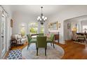 Elegant dining room filled with natural light, hardwood floors, and views of the outdoors at 4109 Riverview Blvd, Bradenton, FL 34209