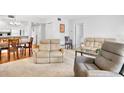 Spacious living room with a dining area and comfortable seating at 4632 Ringwood Mdw # 28, Sarasota, FL 34235