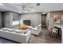 Bright living room with modern furnishings, ceiling fan, and wood-look floors at 4850 51St W St # 4205, Bradenton, FL 34210
