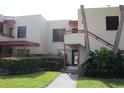 Condominium building with well-maintained landscaping and walkway leading to the entrance, creating a welcoming curb appeal at 515 Spring Lakes Blvd # 515, Bradenton, FL 34210