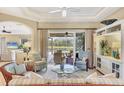 Comfortable living room with a ceiling fan and a view of the lanai at 7816 Ashley Cir, University Park, FL 34201