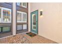Inviting courtyard entrance with teal door and beach-themed welcome mat at 800 S Blvd Of The Presidents # 3, Sarasota, FL 34236