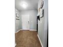 Inviting entryway featuring tile flooring and a coat rack by the front door at 1107 22Nd E St, Palmetto, FL 34221