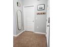 Entryway with tiled flooring and a coat rack by the front door at 1107 22Nd E St, Palmetto, FL 34221