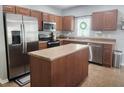 Well-equipped kitchen with stainless steel appliances and central island at 1107 22Nd E St, Palmetto, FL 34221