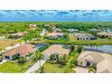 Neighborhood view of homes with tropical landscaping and nearby waterways and green spaces at 12822 Kite Dr, Bradenton, FL 34212