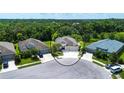 Picture of a neighborhood street with well-maintained homes, lush landscaping and mature trees at 12841 Balsam Ter, Bradenton, FL 34212