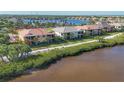 Beautiful waterfront home with screened lanai, lush landscaping, and serene canal views at 1294 Riverscape St # D, Bradenton, FL 34208