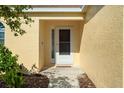 Entrance featuring a screen door and well maintained landscaping at 3413 5Th W Dr, Palmetto, FL 34221