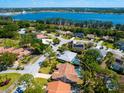 An aerial view of the property highlighting the home's pool, close proximity to the water and surrounding community at 3786 Surrey Ln, Sarasota, FL 34235