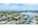 Coastal community featuring waterfront homes, private docks, and a scenic view of the open water at 3941 14Th Ne Ln, St Petersburg, FL 33703