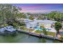 Waterfront property with a private dock, boat lift, swimming pool and clear views of the sunset at 3941 14Th Ne Ln, St Petersburg, FL 33703