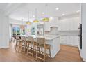 Elegant kitchen with marble countertops, stainless steel appliances, and breakfast bar at 4104 Las Palmas Way, Sarasota, FL 34238