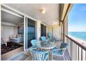 Relax on this lovely balcony with outdoor seating and breathtaking views of the beach and ocean at 4401 Gulf Of Mexico Dr # 907, Longboat Key, FL 34228