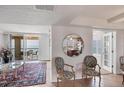 Elegant living room with plush seating, stylish decor, and stunning views of the ocean from the balcony at 4401 Gulf Of Mexico Dr # 907, Longboat Key, FL 34228