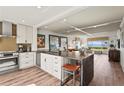 Modern kitchen with stainless appliances, island, and beautiful views of the water at 4600 Gulf Of Mexico Dr # 201, Longboat Key, FL 34228