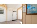 Inviting front door with a charming welcome mat on a tile floor at 5053 Live Oak Cir, Bradenton, FL 34207