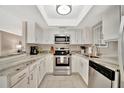 Modern kitchen with white cabinets, stainless steel appliances, and ample counter space at 5307 1St Avenue Nw Dr, Bradenton, FL 34209