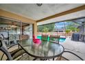 Enjoy this relaxing covered patio with a screened-in pool, perfect for entertaining and outdoor dining at 5307 1St Avenue Nw Dr, Bradenton, FL 34209