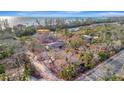 Expansive property surrounded by mature trees offers an exceptional canvas for your dream home at 8555 Heron Lagoon Cir, Sarasota, FL 34242