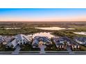 An aerial view of the luxury home showcasing the water view and community layout at 9241 Starry Night Ave, Sarasota, FL 34241