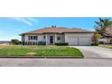 Beautiful single-story home with a well-maintained lawn and a two-car garage at 2305 Riverview Blvd, Bradenton, FL 34205
