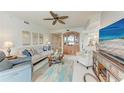 Inviting living room with comfortable seating, ceiling fan, and view to dining at 23261 Banbury Way # 501, Venice, FL 34293