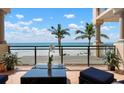 Enjoy spectacular ocean views from this private balcony with comfortable seating and stylish decor at 2333 Gulf Of Mexico Dr # 1A2, Longboat Key, FL 34228