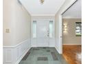 Inviting foyer with tile flooring and classic architectural details at 320 25Th W St, Bradenton, FL 34205