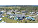 Wide aerial view of a charming home with lush landscaping and fenced pool in neighborhood at 3711 118Th W St, Bradenton, FL 34210