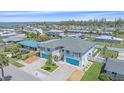 Wide aerial view of a charming duplex property with lush landscaping and neighborhood with bay views at 3711 118Th W St, Bradenton, FL 34210