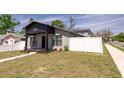 This freshly painted home has a neat yard and modern accents at 4501 20Th S Ave, St Petersburg, FL 33711