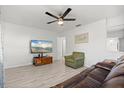 Open-concept living area featuring lots of natural light and laminate wood flooring at 5001 15Th N Ave, St Petersburg, FL 33710