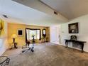 Spacious living room featuring a large bay window, neutral carpet and walls at 5711 Garden Lakes Palm, Bradenton, FL 34203