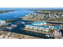 Scenic aerial view of waterfront condos and boat docks along the water at 8222 Harborside Cir, Englewood, FL 34224