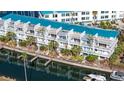 Exterior condo view shows building's architectural details and waterfront access at 8222 Harborside Cir, Englewood, FL 34224